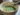 A cup of prepared matcha tea made from high-quality green tea matcha tea powder.