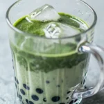 Delicious and refreshing Matcha Boba Tea layered with creamy milk