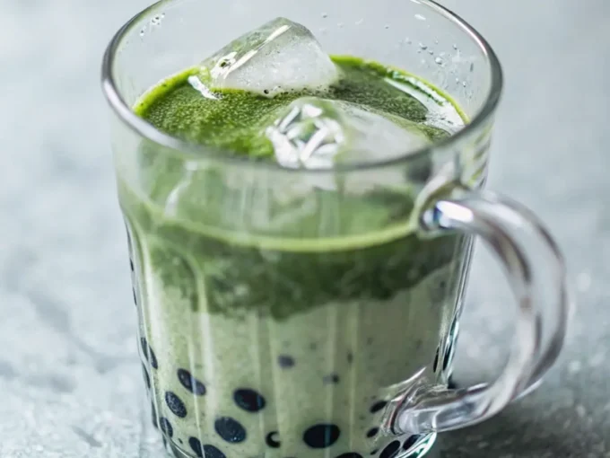 Delicious and refreshing Matcha Boba Tea layered with creamy milk