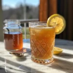 Jar of Honey Trick Recipe for Memory Loss with raw honey, cinnamon, lemon, and walnuts on a wooden table